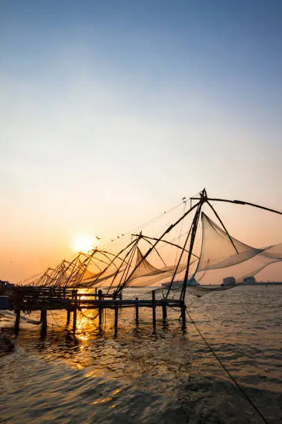 The Chinese fishing nets at sunset in Kochi, India.