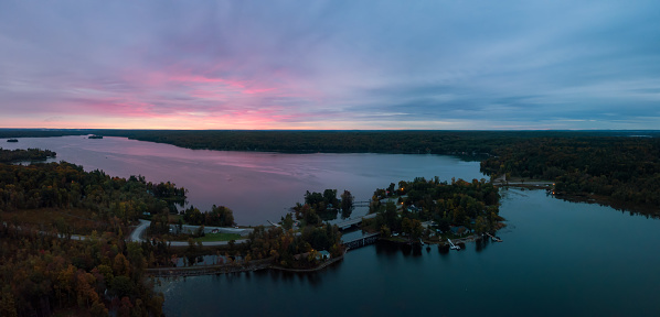Aerial Panoramic view of Moira Lake during a striking and colorful sunrise. Taken in Madoc, Ontario, Canada.