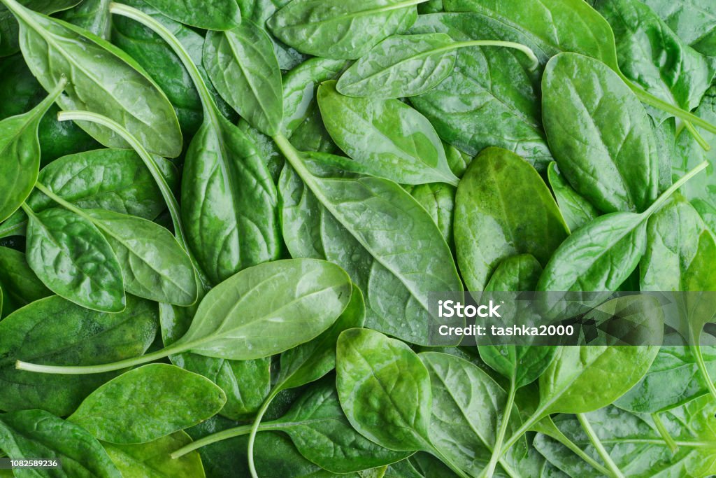 Fresh spinach leaves Fresh spinach leaves as background, top view Spinach Stock Photo