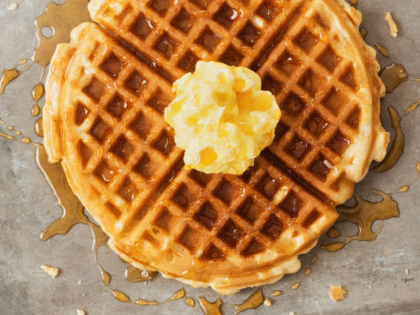 istock rustic traditional waffle with butter and maple syrup 1082589684