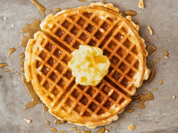 istock rustic traditional waffle with butter and maple syrup 1082589724