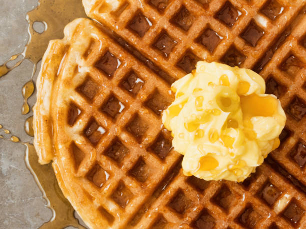 rustic traditional waffle with butter and maple syrup - waffle imagens e fotografias de stock
