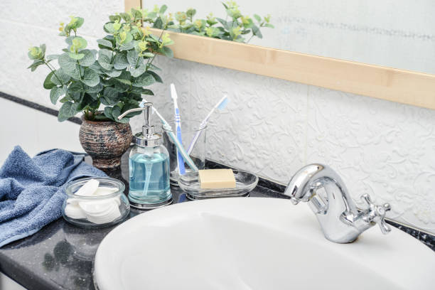 istock Bathroom set with toothbrushes, towels and soap 1082591408