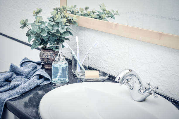 istock Bathroom set with toothbrushes, towels and soap 1082591410