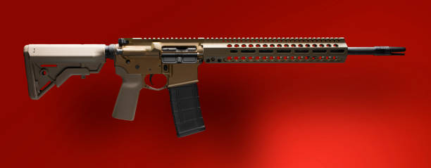 istock Brown AR-15 and shadow on a red background 1082600410