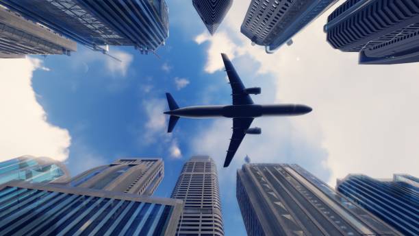 istock Airplane flies over a modern megapolis at sunrise. 3D Rendering 1082600650