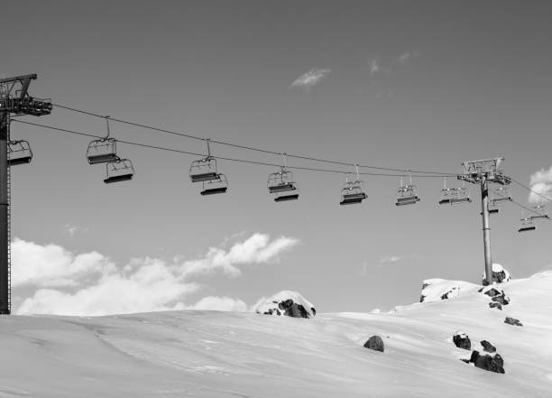 istock Sunlight chair-lift at ski resort on sun cold evening 1082603282