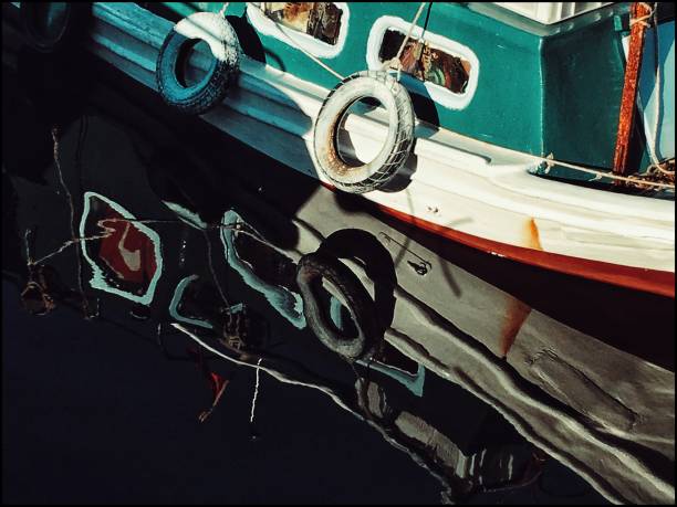 istock Nautical vessel and reflection on the sea 1082608350