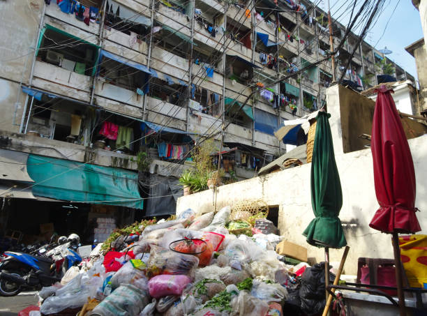 istock Garbage mountain in a backyard of a market place 1082609202