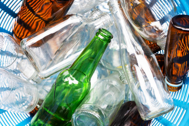 istock Glass bottles in waste basket. 1082610026