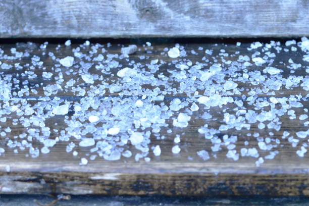 Road Rock Salt on Wooden Stair Step Close Up Abstract