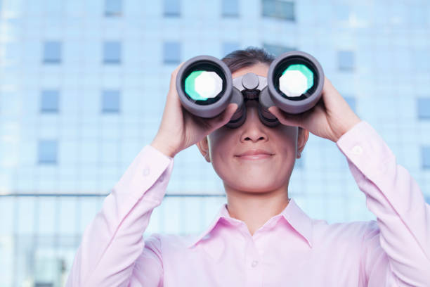 istock Chinese businesswoman using binoculars 1082643538