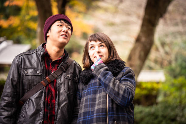 istock Young people in autumn foliage 1082650134