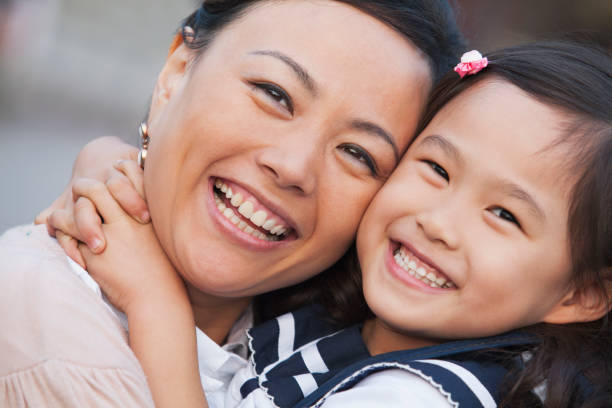 istock Smiling Chinese mother and daughter 1082659534