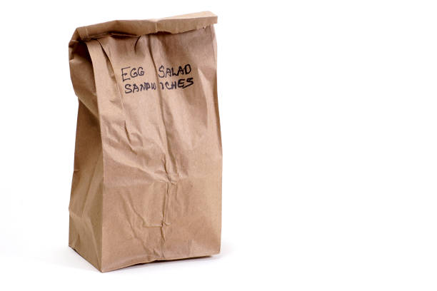 istock Brown Paper Lunch Bag with Egg Salad Sandwiches 1082670286