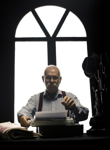 Old style journalist with type writer.