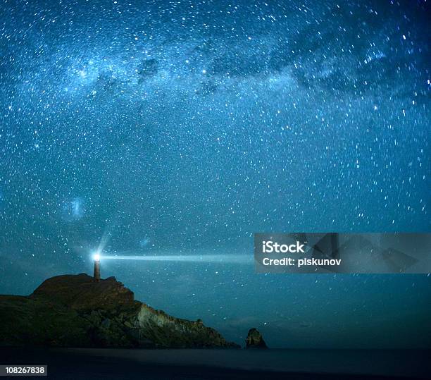 Lighthouse Under Milky Way Stars Stock Photo - Download Image Now - Lighthouse, Hope - Concept, Night