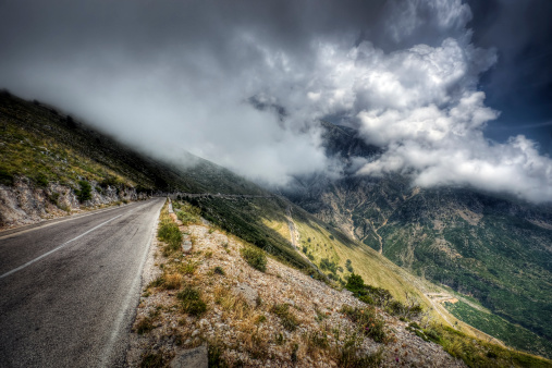 View down a dirt road in the Albanian mountains with storm clouds approaching.  \n\nPlease see my related collections...\n\n[url=search/lightbox/7431206][img]http://i161.photobucket.com/albums/t218/dave9296/Lightbox_Vetta.jpg[/img][/url]\n\n[url=search/lightbox/6710118][img]http://i161.photobucket.com/albums/t218/dave9296/Lightbox_Albania-V2.jpg[/img][/url]\n[url=search/lightbox/8833461][img]http://i161.photobucket.com/albums/t218/dave9296/Lightbox_Balkans.jpg[/img][/url]\n[url=search/lightbox/6315481][img]http://i161.photobucket.com/albums/t218/dave9296/Lightbox_HDR2-V2.jpg[/img][/url]\n[url=search/lightbox/4703719][img]http://i161.photobucket.com/albums/t218/dave9296/Lightbox_maj_alps1-V2.jpg[/img][/url]\n[url=search/lightbox/4719824][img]http://i161.photobucket.com/albums/t218/dave9296/Lightbox_travelers-V2.jpg[/img][/url]