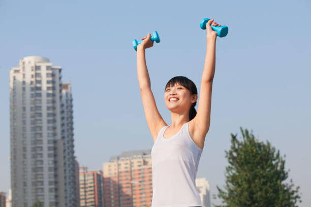 Green dumbbells on a white background good health concept.