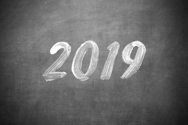istock Happy New Year 2019 Hand Writting on classroom blackboard 1082680726