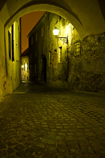 Old city street by nigh.