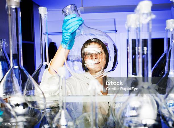 Scientist Working In Biomedical Laboratory Stock Photo - Download Image Now - Laboratory, One Woman Only, Smiling