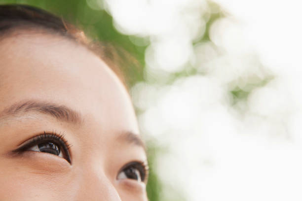 istock Chinese woman's eye looking up 1082682308