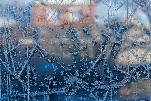 istock intersecting to frost line, patterns on the window glass 1082683318