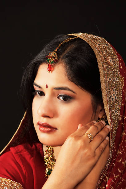 istock Young Indian woman posing, wearing traditional outfit (lehenga, maangtika) 108268341