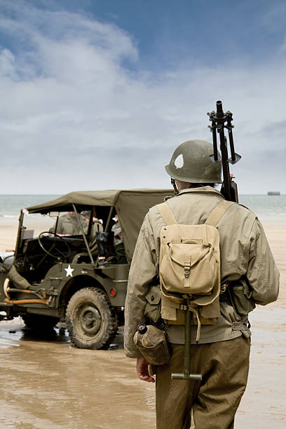 Soldier on beach at D Day stock photo