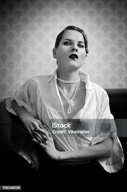 Woman Stock Photo - Download Image Now - Coco Chanel, Pearl Jewelry, Dark -  iStock
