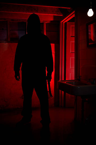 Dark Hooded Killer with Knife in Basement, Copy Space  creepy stalker stock pictures, royalty-free photos & images