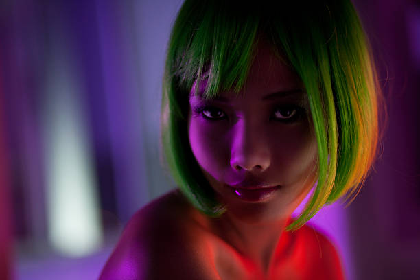 istock Young Woman Wearing Green Wig in Multi-Colored Lights 108268646