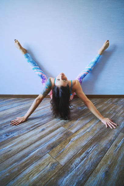istock Young brunette woman practicing yoga at home. 1082687810