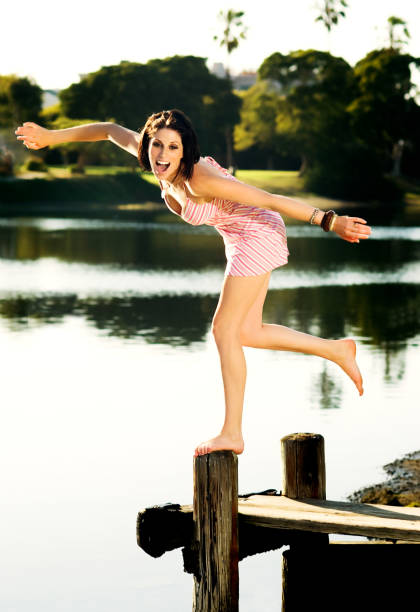 istock Young Woman Playing Near Lagoon 108268994