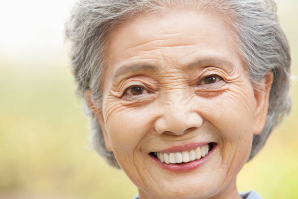 istock Smiling older Chinese woman 1082691456