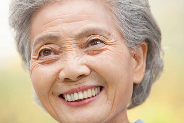 istock Smiling older Chinese woman 1082691488