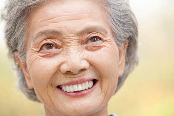 istock Smiling older Chinese woman 1082691540