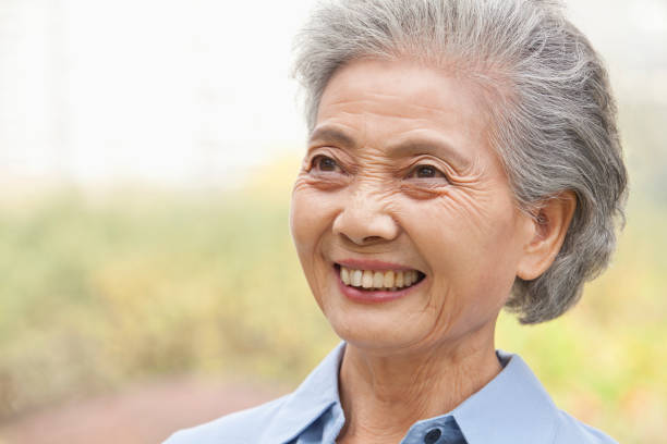 istock Smiling older Chinese woman 1082691592