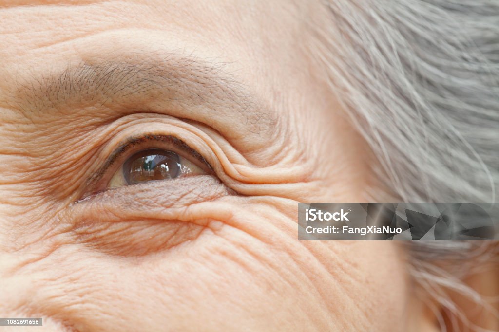 Close up of older Chinese woman's eye Close up of older Chinese woman’s eye Eye Stock Photo