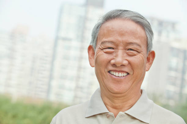 istock Smiling senior Chinese man looking at camera 1082691924