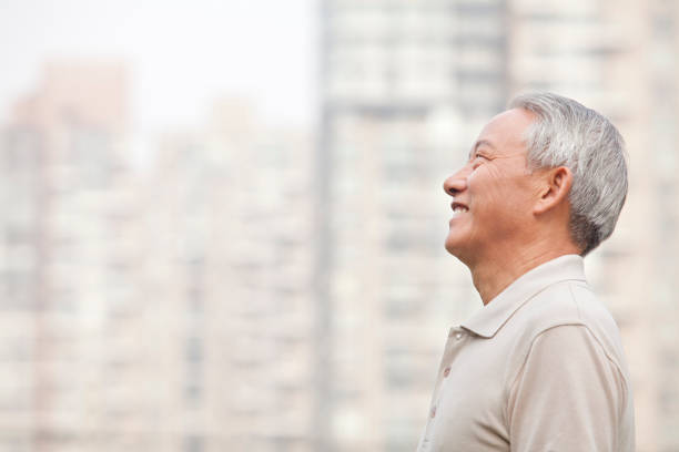 istock Smiling Chinese man looking away 1082693016