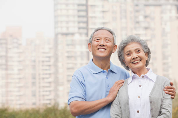 istock Smiling Chinese couple planning future 1082693126