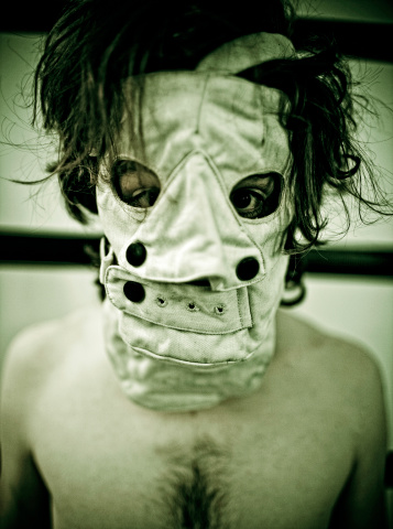 masked sinister man mugshot.