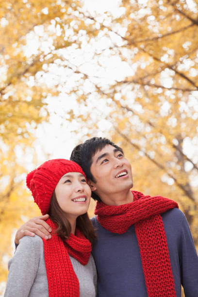 istock Chinese couple hugging outdoors 1082694734