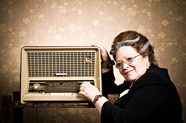 Granny's Party Retro styled granny enjoying the music. old person listening to radio stock pictures, royalty-free photos & images
