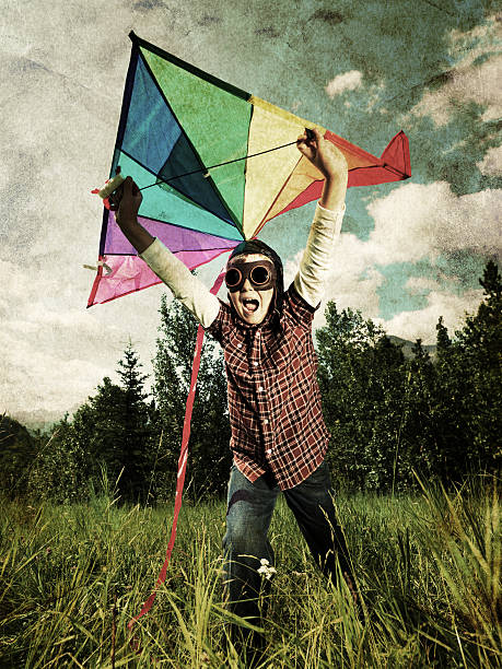 Little boy playing with a kite. Grain and texture added. HQlypse, friday