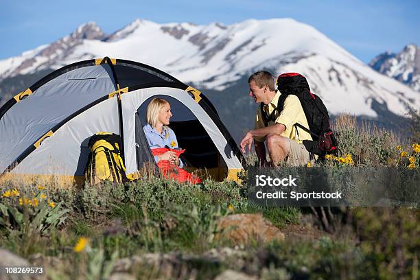 Young Couple With Tent And Backpacks Camping In Colorado Stock Photo - Download Image Now