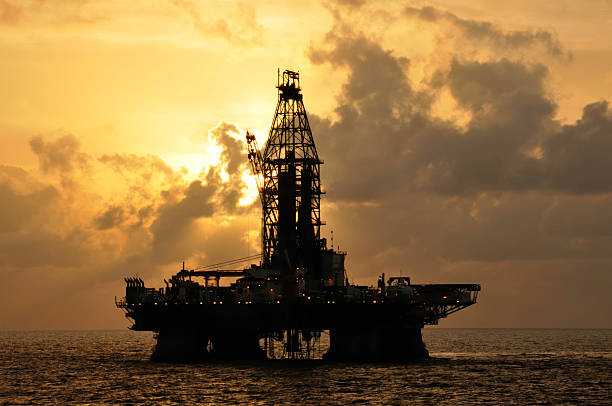 Offshore oil rig with sun stock photo