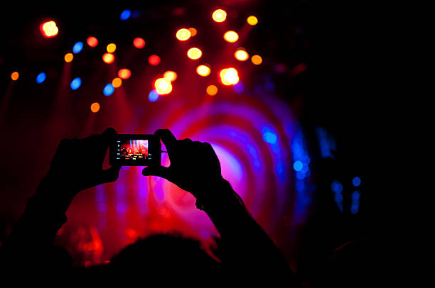 istock taking picture at live concert 108270110